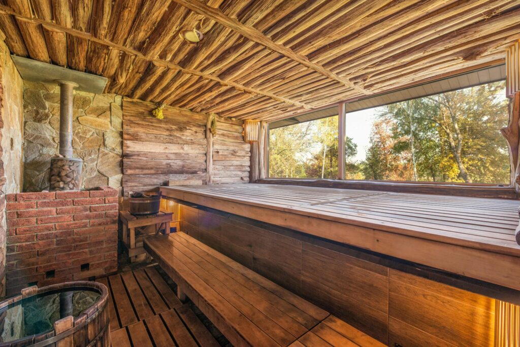 Explore the warmth and relaxation of a rustic sauna with wooden design elements.